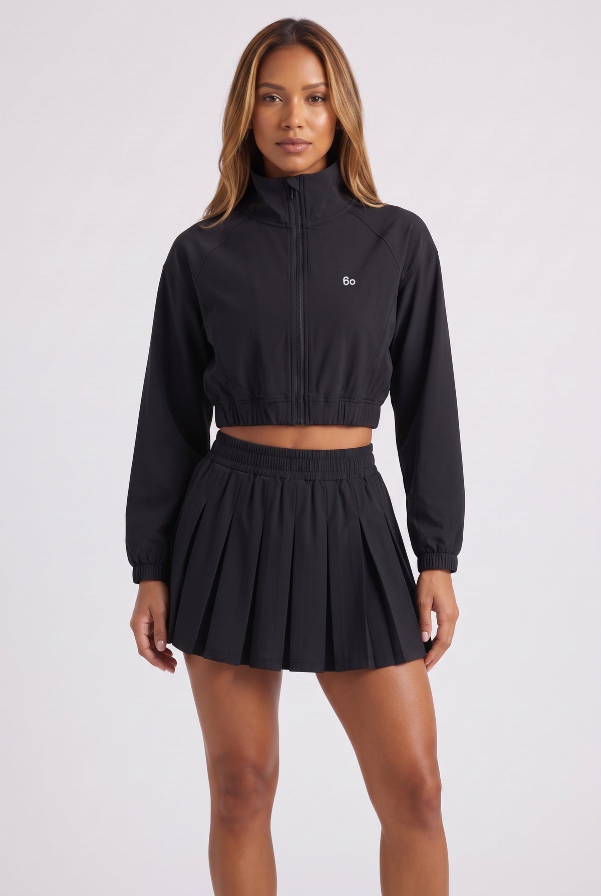 ELSA cropped jacket & pleated skirt set in Black – women's padel set by Six'o – front view