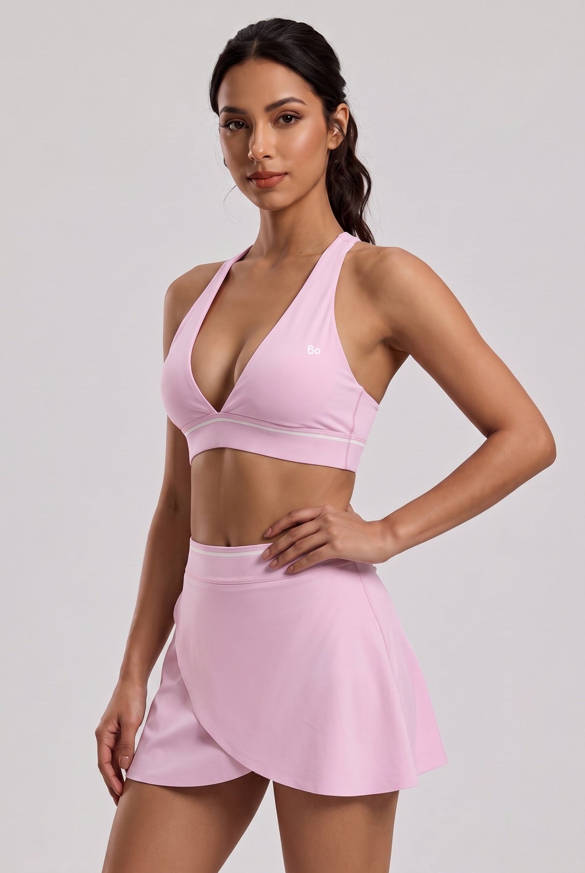 FREYA plunge bra & skirt set in Pink diamond – women's padel set by Six'o – studio photo