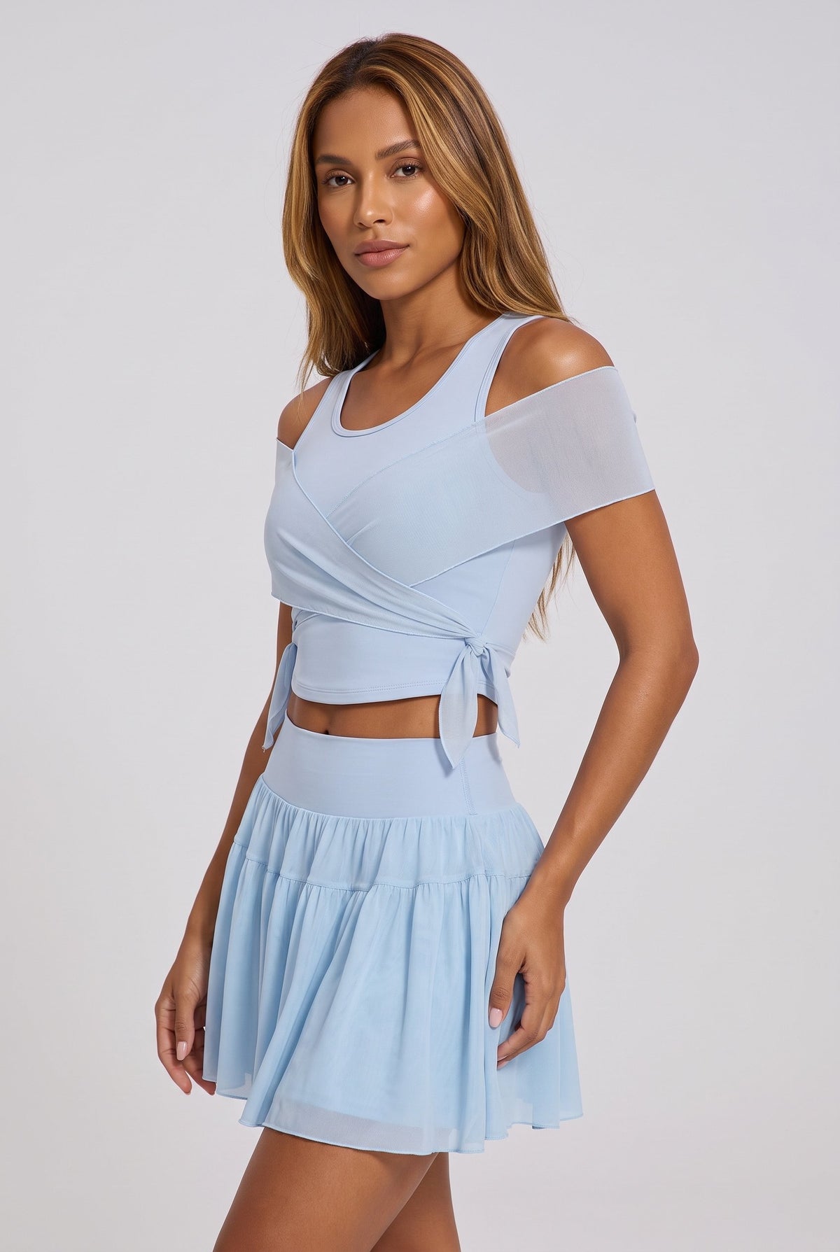 LILA cold-shoulder top & tiered skirt set in Blue – women's padel set by Six'o – studio photo