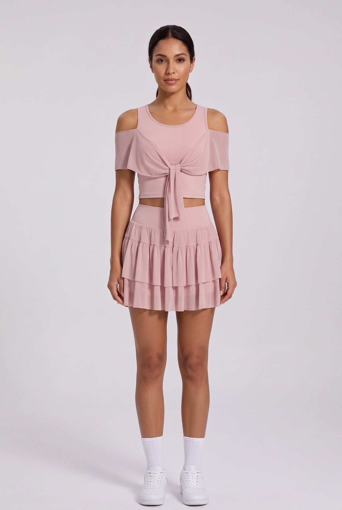 LILA cold-shoulder top & tiered skirt set in Primrose pink – women's padel set by Six'o – front view