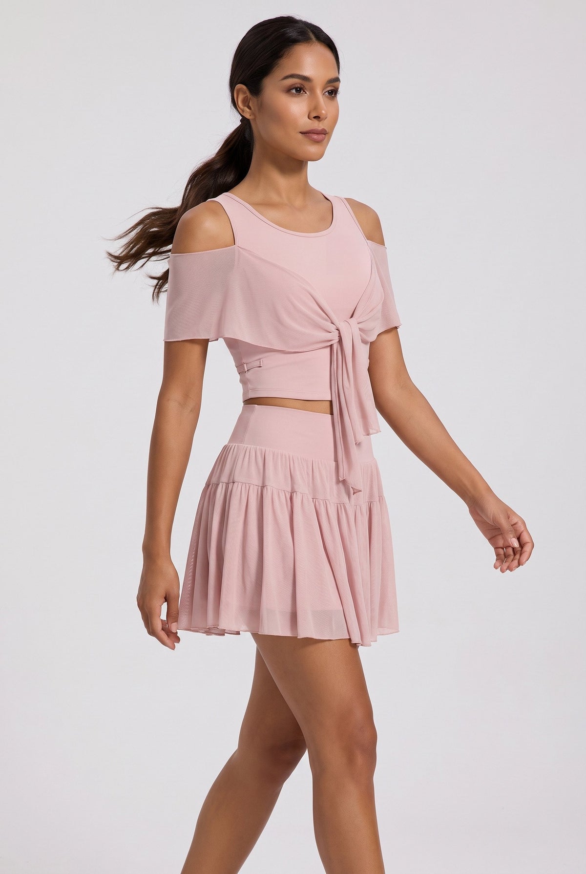 LILA cold-shoulder top & tiered skirt set in Primrose pink – women's padel set by Six'o – full-length studio photo
