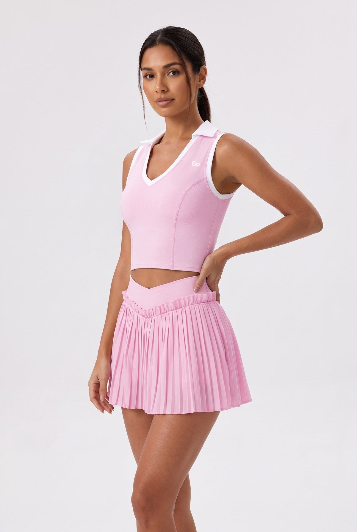 LUNA v-neck top & pleated skirt set in Pink – women's padel set by Six'o – studio photo