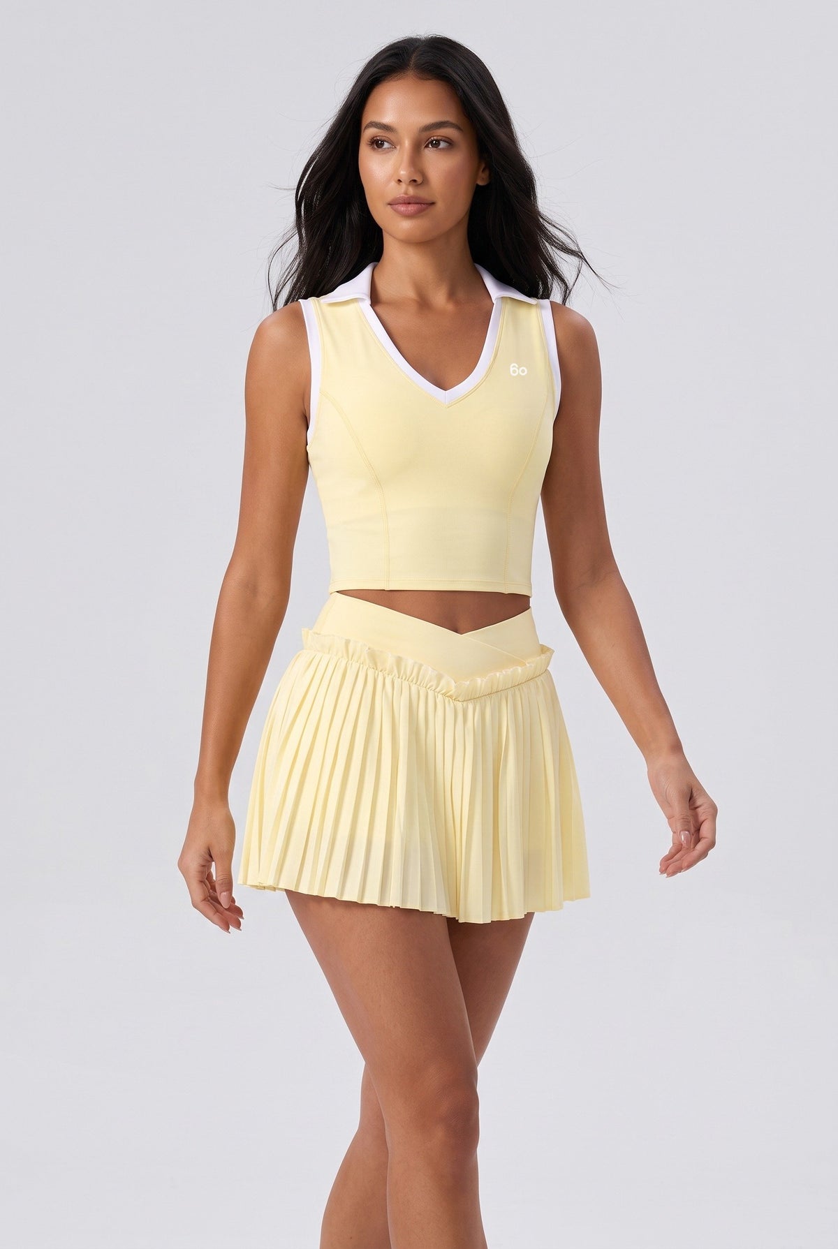 LUNA v-neck top & pleated skirt set in Yellow – women's padel set by Six'o – full-length studio photo
