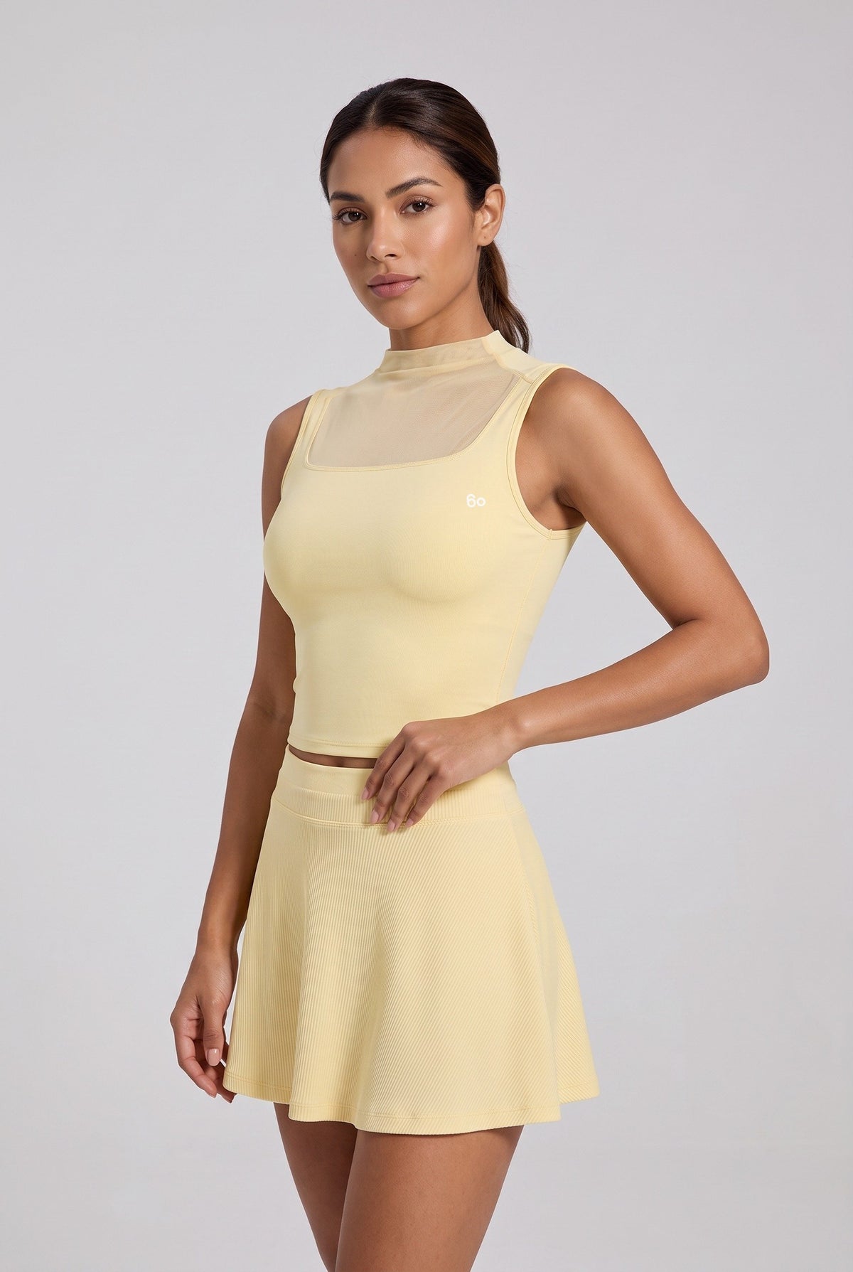 MAYA mesh tank & pleated skirt set in Pear yellow – women's padel set by Six'o – studio photo