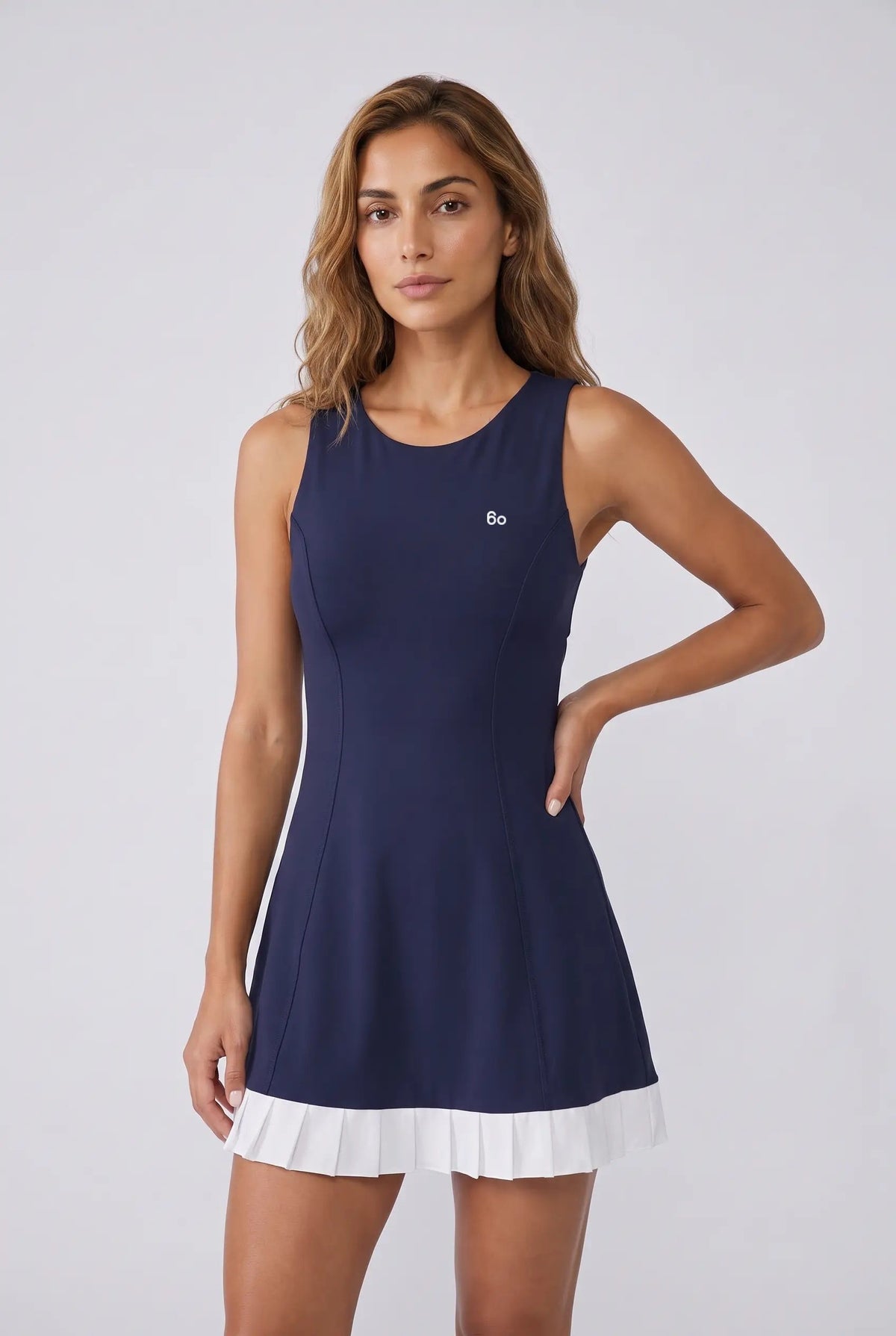 AMBER cross-back padel dress in Navy – women's padel dress by Six'o – studio photo