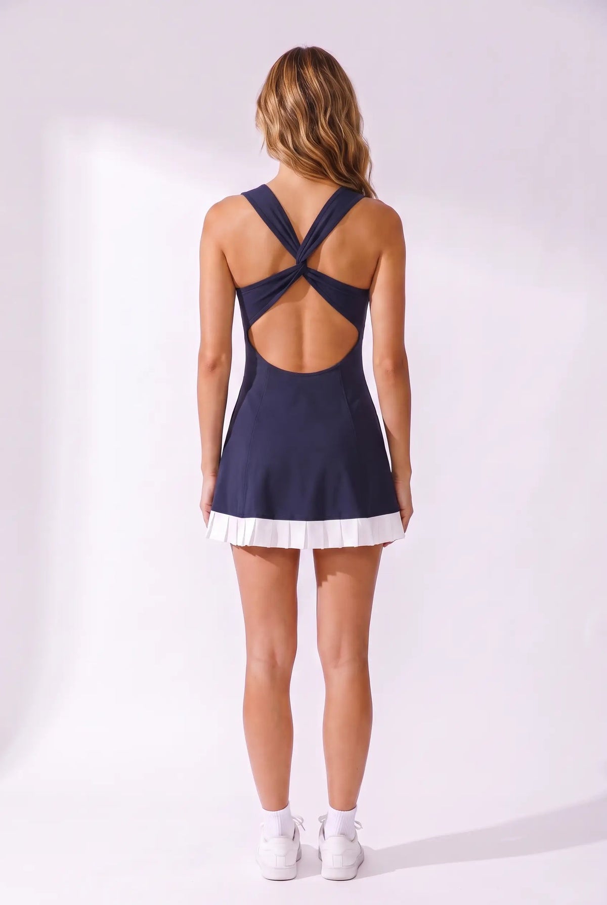 AMBER cross-back padel dress in Navy – women's padel dress by Six'o – back view