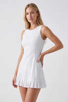 AMBER cross-back padel dress in White – women's padel dress by Six'o – studio photo