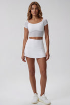 AVA mesh sleeve top & skort set in White – women's padel set by Six'o – front view