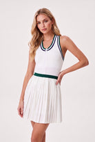 CHLOE varsity v-neck padel dress in Green – women's padel dress by Six'o – studio photo