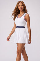 CHLOE varsity v-neck padel dress in Royal blue – women's padel dress by Six'o – full-length studio photo