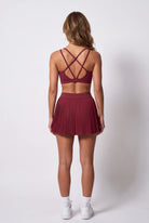 CORA bra top & pleated skirt set in Cherry red – women's padel set by Six'o – back view