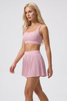 CORA bra top & pleated skirt set in Cream pink – women's padel set by Six'o – full-length studio photo