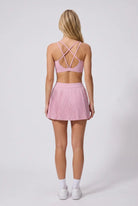 CORA bra top & pleated skirt set in Cream pink – women's padel set by Six'o – back view
