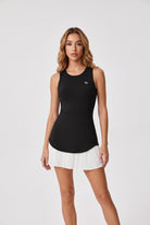 DAISY colourblock pleated dress in Black – women's padel dress by Six'o – front view