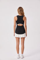 DAISY colourblock pleated dress in Black – women's padel dress by Six'o – back view
