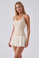 ELLA scoop neck pleated padel dress in Beige – women's padel dress by Six'o – front view