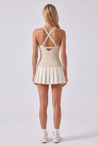 ELLA scoop neck pleated padel dress in Beige – women's padel dress by Six'o – back view
