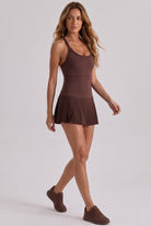 ELLA scoop neck pleated padel dress in Brown – women's padel dress by Six'o – full-length studio photo