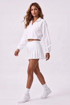 ELSA cropped jacket & pleated skirt set in White – women's padel set by Six'o – full-length studio photo
