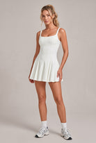 EMMA square neck pleated dress in Ivory – women's padel dress by Six'o – studio photo