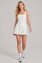 EMMA square neck pleated dress in Ivory – women's padel dress by Six'o – full-length studio photo