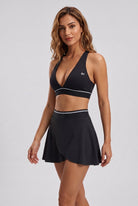 FREYA plunge bra & skirt set in Black – women's padel set by Six'o – full-length studio photo