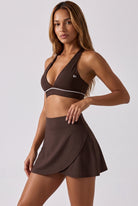 FREYA plunge bra & skirt set in Espresso brown – women's padel set by Six'o – studio photo