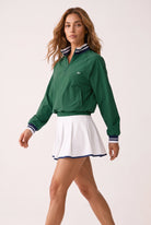 GRACE zip sweater & skirt set in Green sweater white skirt – women's padel set by Six'o – full-length studio photo