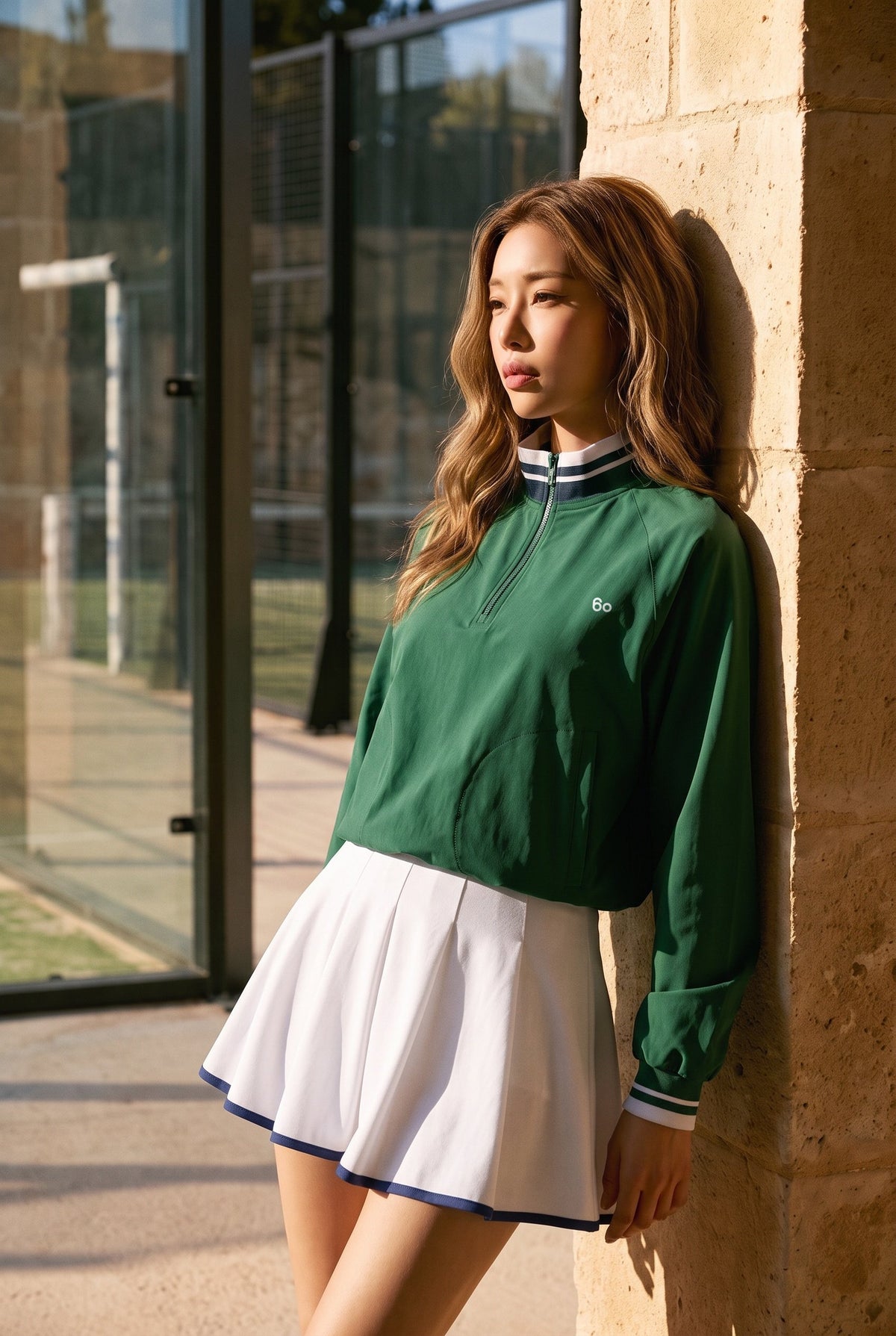 GRACE zip sweater & skirt set in Green sweater white skirt – women's padel set by Six'o – lifestyle photo at the padel club