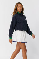 GRACE zip sweater & skirt set in Navy sweater white skirt – women's padel set by Six'o – full-length studio photo
