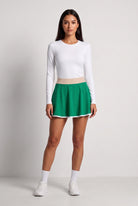 GRACE zip sweater & skirt set in White sweater green skirt – women's padel set by Six'o – front view