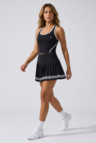 IVY tipped tank & pleated skirt set in Black – women's padel set by Six'o – full-length studio photo