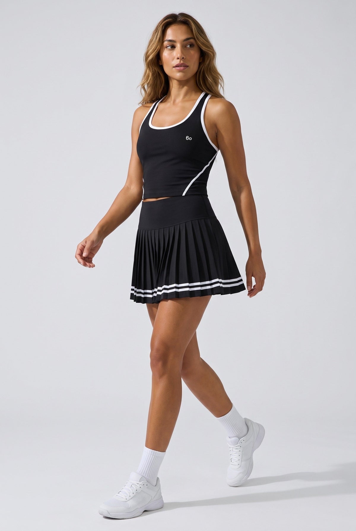 IVY tipped tank & pleated skirt set in Black – women's padel set by Six'o – full-length studio photo