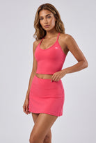 JADE cami top & skirt set in Neon pink – women's padel set by Six'o – studio photo