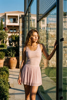 LEA square neck top & lace skirt set in Nude pink – women's padel set by Six'o – lifestyle photo at the padel club