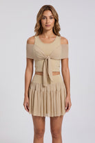 LILA cold-shoulder top & tiered skirt set in Almond yellow – women's padel set by Six'o – front view