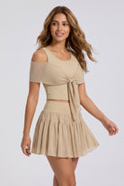 LILA cold-shoulder top & tiered skirt set in Almond yellow – women's padel set by Six'o – full-length studio photo