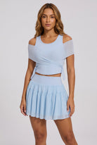 LILA cold-shoulder top & tiered skirt set in Blue – women's padel set by Six'o – front view