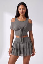 LILA cold-shoulder top & tiered skirt set in Grey – women's padel set by Six'o – front view