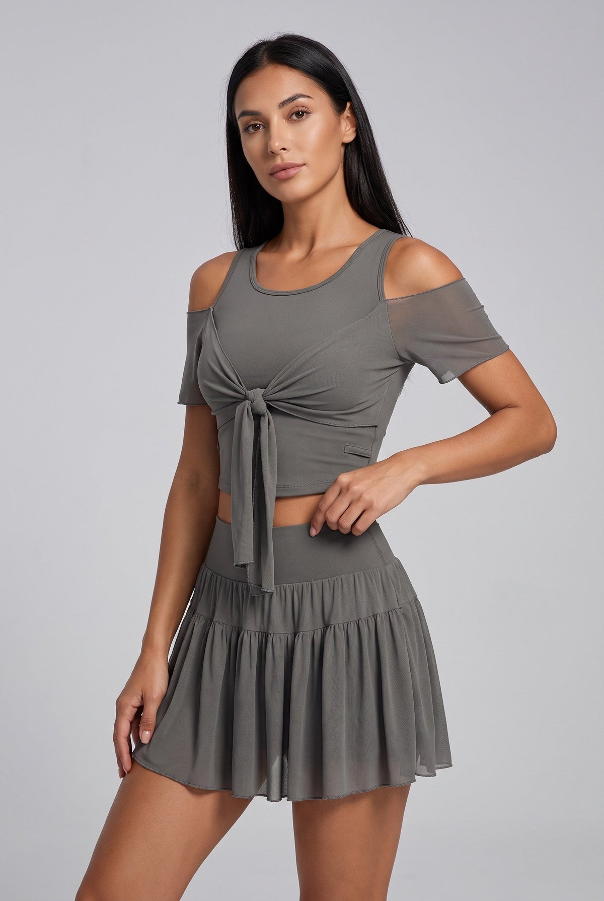 LILA cold-shoulder top & tiered skirt set in Grey – women's padel set by Six'o – studio photo