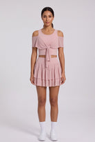 LILA cold-shoulder top & tiered skirt set in Primrose pink – women's padel set by Six'o – front view