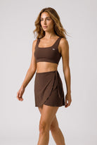 LIV bra top & wrap skirt set in Brown – women's padel set by Six'o – full-length studio photo