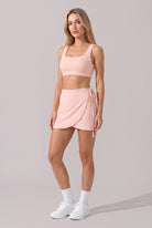 LIV bra top & wrap skirt set in Pink – women's padel set by Six'o – front view