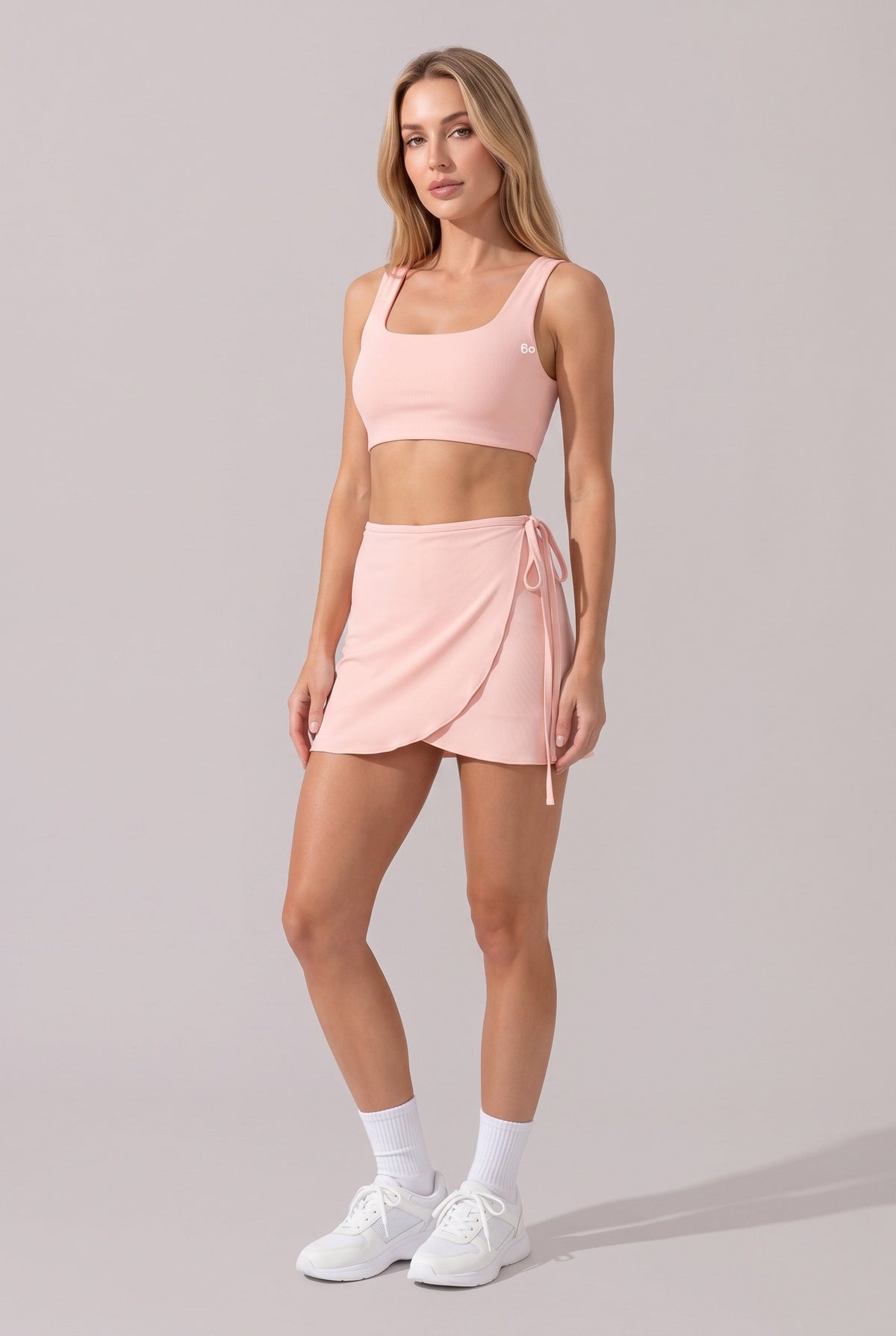 LIV bra top & wrap skirt set in Pink – women's padel set by Six'o – front view