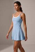 LOLA racerback padel dress in Sun blue – women's padel dress by Six'o – full-length studio photo
