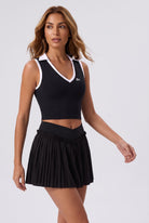 LUNA v-neck top & pleated skirt set in Black – women's padel set by Six'o – full-length studio photo