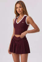 LUNA v-neck top & pleated skirt set in Burgundy – women's padel set by Six'o – studio photo
