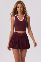 LUNA v-neck top & pleated skirt set in Burgundy – women's padel set by Six'o – full-length studio photo