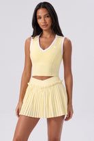 LUNA v-neck top & pleated skirt set in Yellow – women's padel set by Six'o – front view