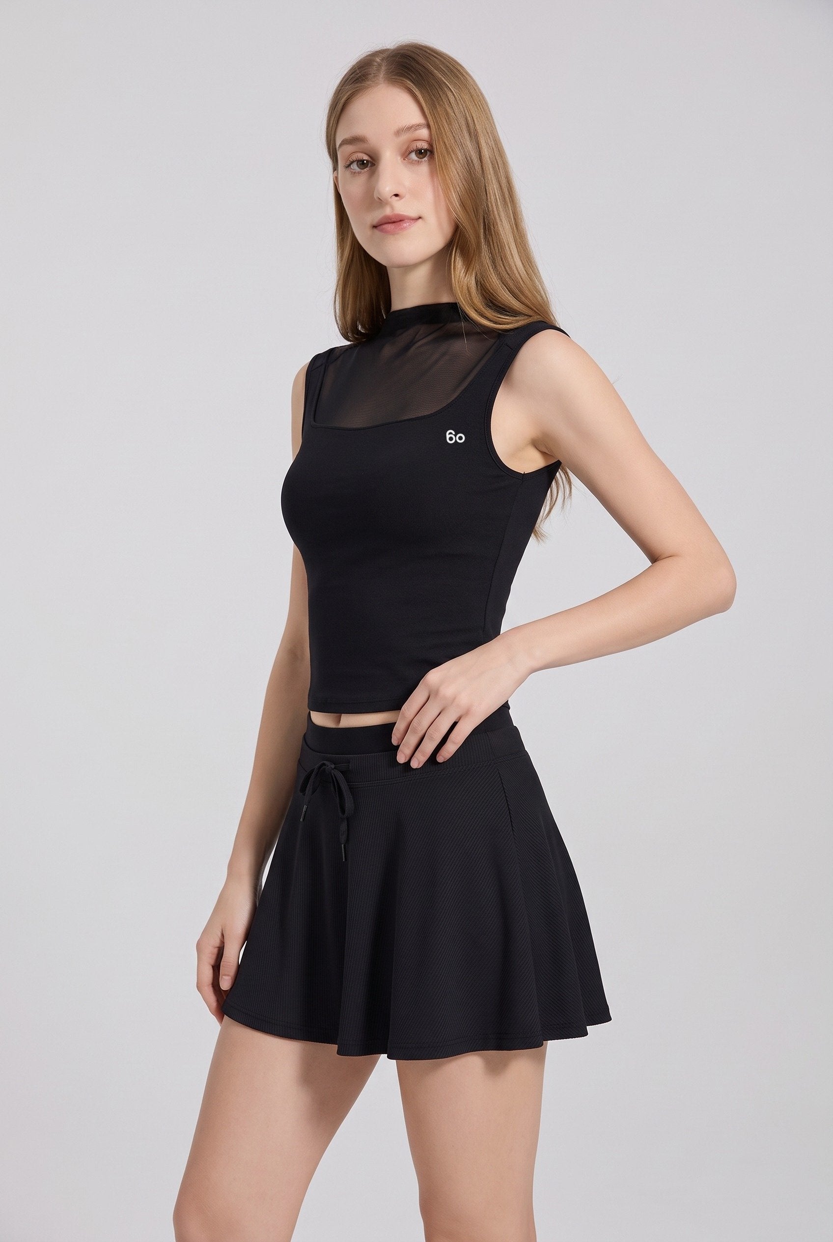 MAYA mesh tank & pleated skirt set in Black – women's padel set by Six'o – studio photo
